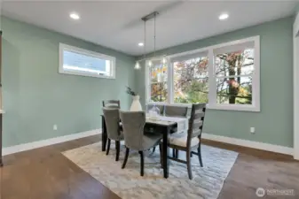 Flexible formal dining space with windows galore. Slider to covered porch is just to the right. Note all windows are wood wrapped.