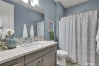 Full bath with tub/shower combination.  Vanity has extra storage.  Close to the two side bedrooms. Makes living and having guests easy!