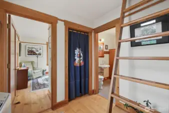 View from kitchen into bedroom, bathroom and stairs to Loft