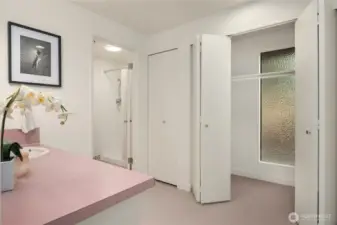 Looking towards the refinished tile shower with privacy door. The closets wrap around to the right.