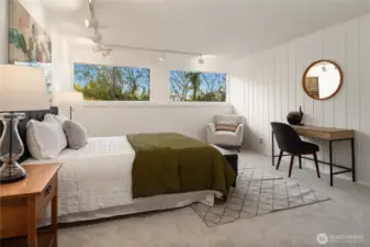 Heading downstairs to the daylight basement this is the third bedroom with great ceiling height, new carpet and new paint.