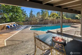 Just off the rec room is this covered patio that looks out over the in ground pool and spa.