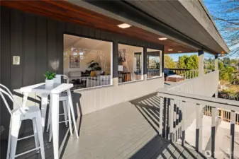 This shot of the deck is just off the dining room looking back across the living room windows.