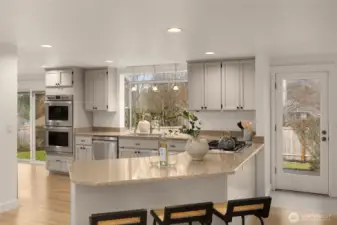 The expansive gourmet kitchen is a true showpiece—featuring sleek cabinetry, quartz counters, and premium stainless appliances