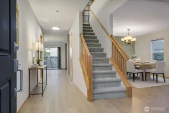 Virtually Staged. Enter to formal living room and dining rooms.