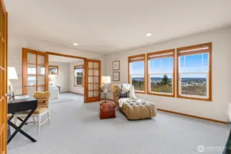 Spacious sitting room is connected to primary suite.