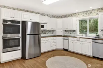 Large kitchen with all new stainless appliances.