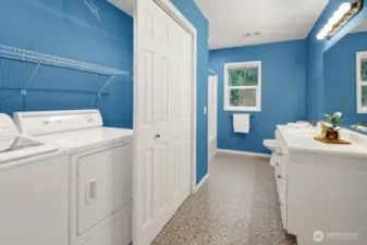 Full bathroom/laundry, near garage entrance.