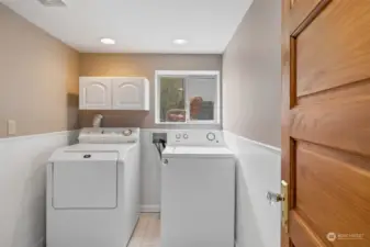 utility room with door to left leading outside.