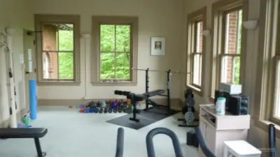 Work out room with weight bench looking North.