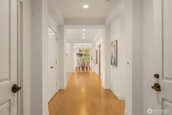 Genuine hardwoods flow from the foyer to light-filled living spaces beyond.