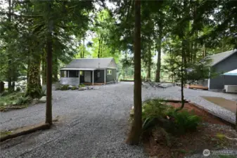 Introducing "Above the Sky" ~ so much to offer with two cozy cabins, a 40' container, separate washhouse w/full laundry, and two EV chargers. Each cabin is equipped with its own Generac generator, ensuring reliable backup power.