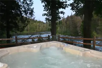 Relax in the hot tub as you overlook the peaceful river ~ natures remedy for stress.