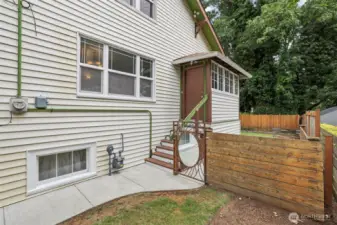 Side yard and fully fenced rear yard.