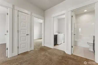 Upstairs showing full bath and laundry room