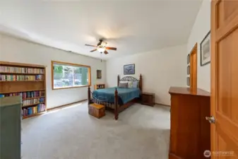 Enter the primary bedroom to the right of the kitchen.  Plenty of room for a king size bed and large furniture.