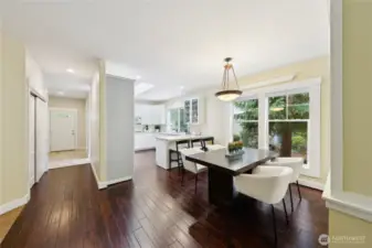 Engineered hardwood flooring throughout the main living areas, complemented by a newly tiled entry for a welcoming first impression.