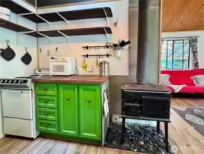 Open shelving in kitchen and butcher block counter top