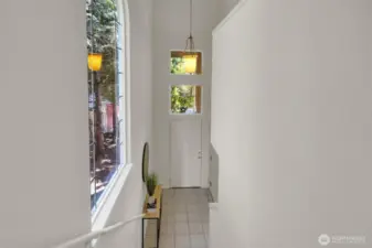 Stairs from upper level towards entry
