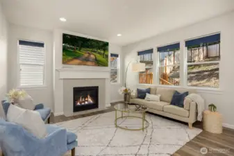 The living room is anchored by the natural gas fireplace with ceramic tile surround. Connections for your entertainment system are located above the elegant mantle.