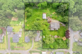 Overhead view shows the shape of the 2 acre property, layout of the house, garage, and Cottage ADU. Roofs were recently cleaned after this photo. House roof new in 2018!