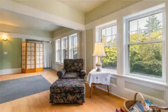 This large room off of the entryway was the original office for the Lumber Mill. To the left, you'll find the original wall safe, as this is where employees of the mill came to pick up their checks. This photo truly exemplifies the large trim work seen throughout the home that is a rare find these days! This room and the hallway have bamboo flooring.