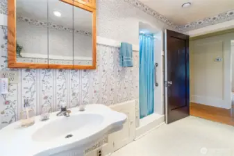 Main floor bathroom with shower access shown.