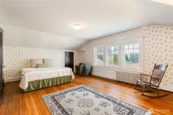 This extra large bedroom #3 upstairs really showcases the beautiful original wood floors.