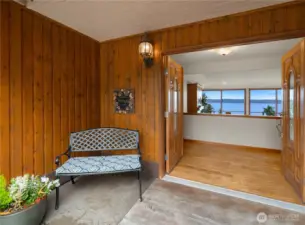 Expansive & covered entry welcomes your family and friends.  Step inside your home and everyone will be focused on the view!