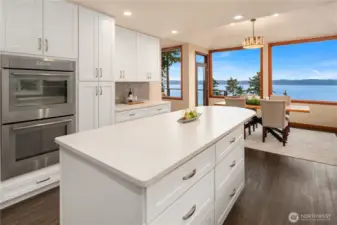 Double Thermador SS ovens and separate counter for beverages highlight this side.