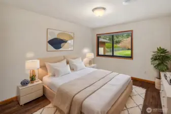 A main level bedroom looks onto the front yard.