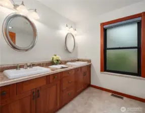 Additional main floor large bathroom features double sinks and custom soaking tub!