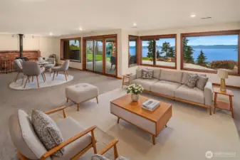 Very large, carpeted lower level with high ceilings features a woodburning stove??, a wall of windows, and a slider to walk outside to your patio and back yard. Both are great gathering areas!