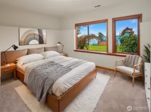 Cozy, lower level bedroom with backyard and water views.