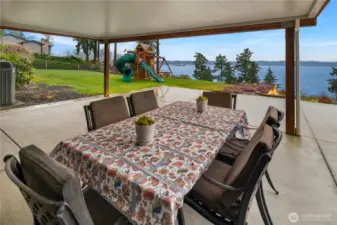 Covered lower level patio area allows outdoor enjoyment, rain or shine!