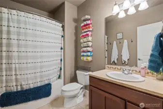 Main level full bath. Travertine flooring andmarble counters.