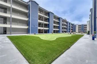 Common area with putting green and bocce ball.