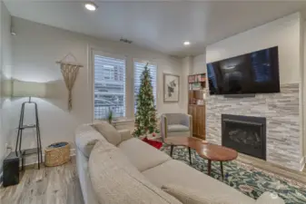 Gas fireplace with stacked stone surround adds a bit of warmth on a cool night.