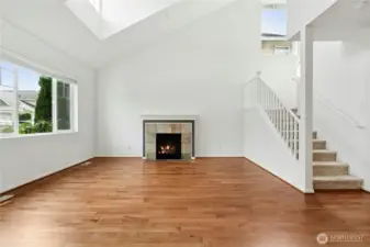Living Room with Vaulted Ceilings and skylight