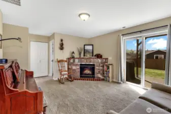 Sliding doors lead to the backyard