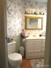 MAIN BATH HAS TUB/SHOWER TO RIGHT AND STROAGE CUBBOARD.