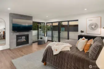 The primary suite is a serene retreat featuring private deck access.