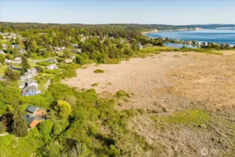 Aerial view near beach, second blue home on left.