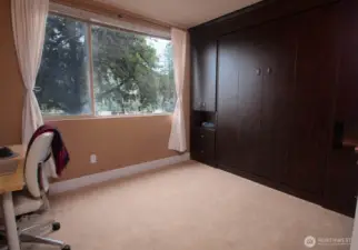 Murphy bed is tucked away in this built-in cabinet when not in use.