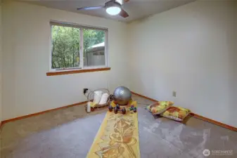 Bedroom. Generous closet, ceiling fan, supplemental wall heat & side yard view