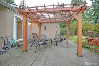 Generous covered patio for lounging and outdoor entertaining.