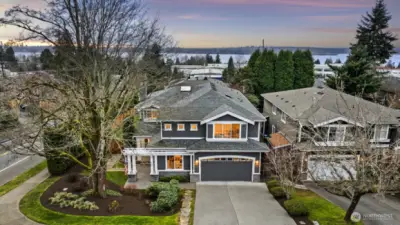 Commanding attention from a southern corner lot on a tree-lined street in coveted Kirkland, this craftsman is the dream home you've been searching for!