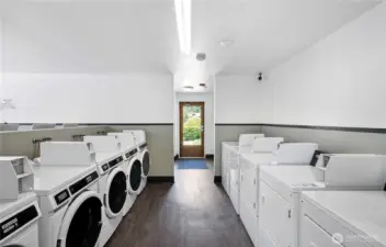 Laundry room w/ ample washers & dryers