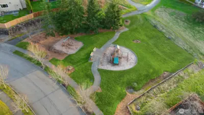 Steps to the small toddler's park a few doors down
