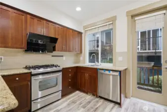 Kitchen with extra storage and connected to an outdoor patio
